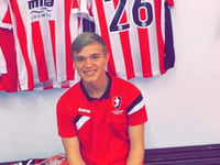Cheltenham Town academy prospect Luke Thomas makes the bench in Tranmere loss