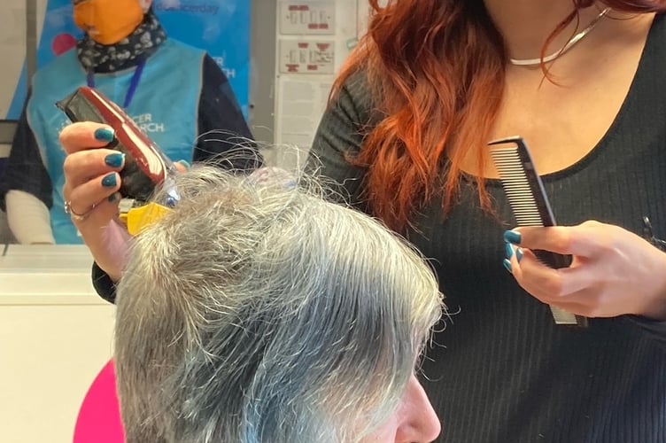 Jade Davies cuts Rainbow Walker’s hair to raise money for Cancer Research UK