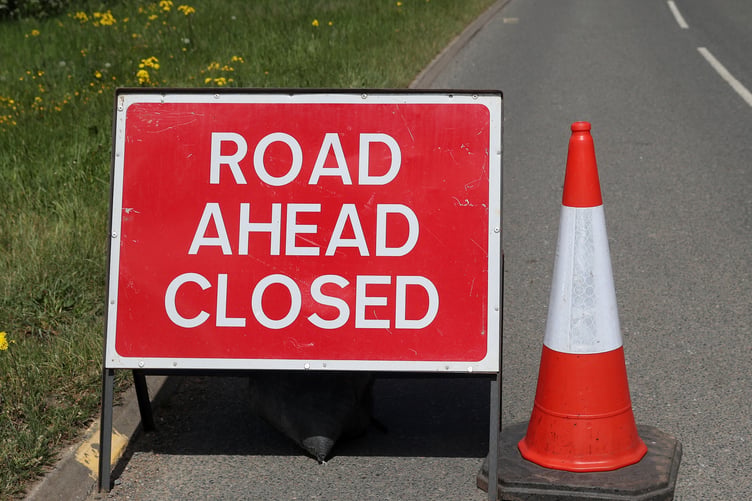 Road Closed signs.