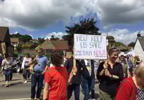 Residents protest for a safe way to cross road