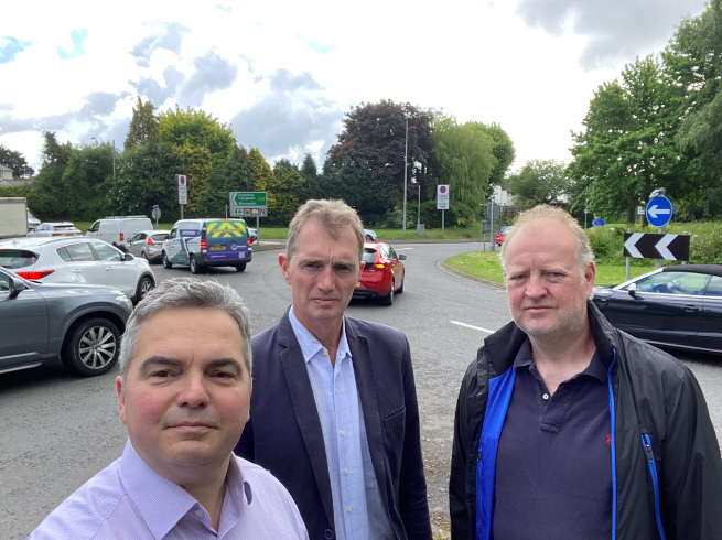 (L-R) St Kingsmark ward councillor Christopher Edwards, David Davies MP and resident Phil Tate at Highbeech roundabout in Chepstow.