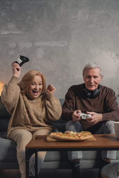 A woman and a man playing video games