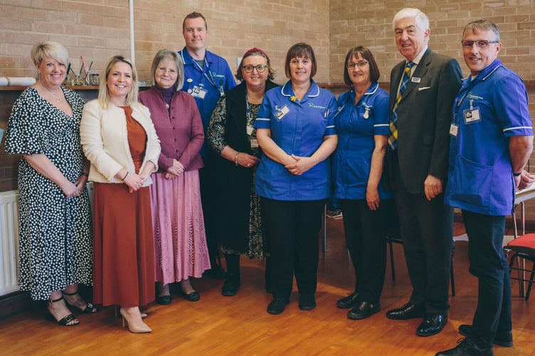 Some of the Crossroads Care Gloucestershire team with John McLean, Chair of the Carers Trust
