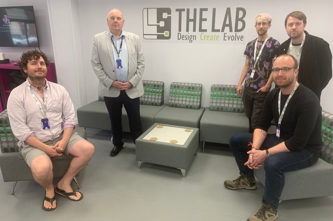 From left. Lab technician Ollie Moss, libraries cabinet member Dave Norman, Lab technician Seth Fright, Lab manager Andy Hayhoe and technician Joel Hawkins 