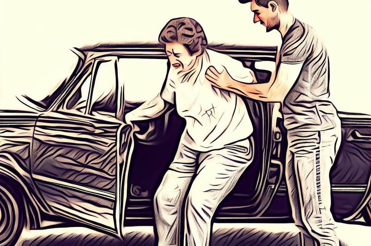 Young man helping woman out of car