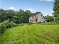 Character cottage for sale sits directly opposite woodland 