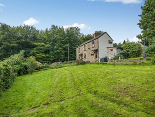 Character cottage for sale sits directly opposite woodland 