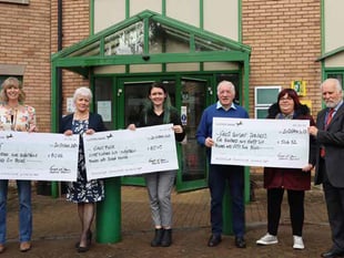 Former Council Chair's chosen charities brave Babet for big cheque