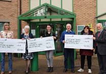 Former Forest Council Chair's chosen charities brave Babet for big cheque