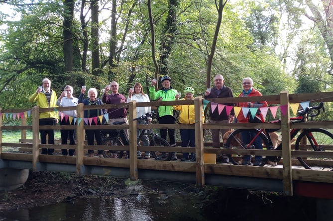 Villagers celebrate new bridge over ford in Oxenhall Lane in Gorsley