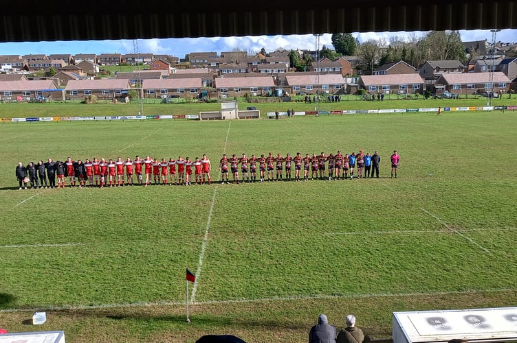 Cinderford Utd and Longlevens observe a minute's silence for Keith Bell