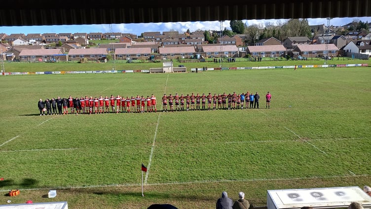 Cinderford Utd and Longlevens observe a minute's silence for Keith Bell