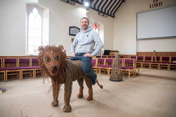 Artist Chris Oakey with the lion centrepiece