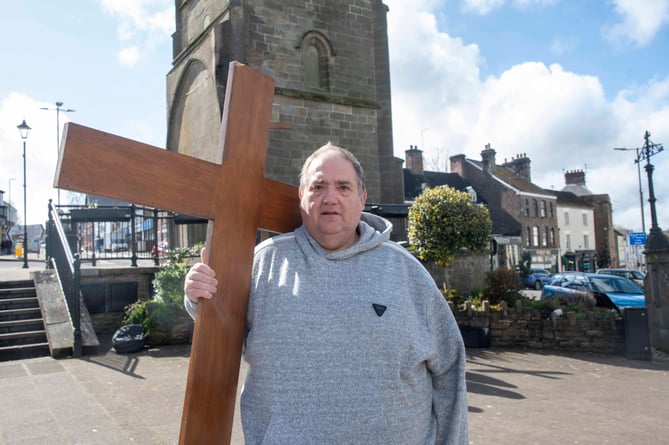 Tony Howarth, of Coleford Baptist Church, carried the cross.