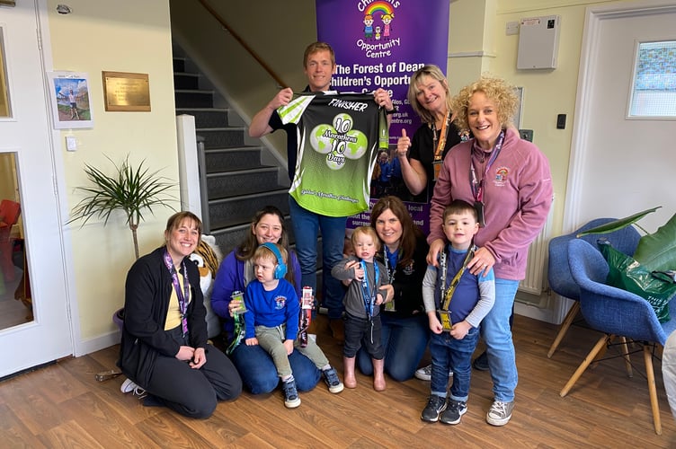 Tom Bell took his medals and finishers' jersey to show children and staff at the Opportunity Centre