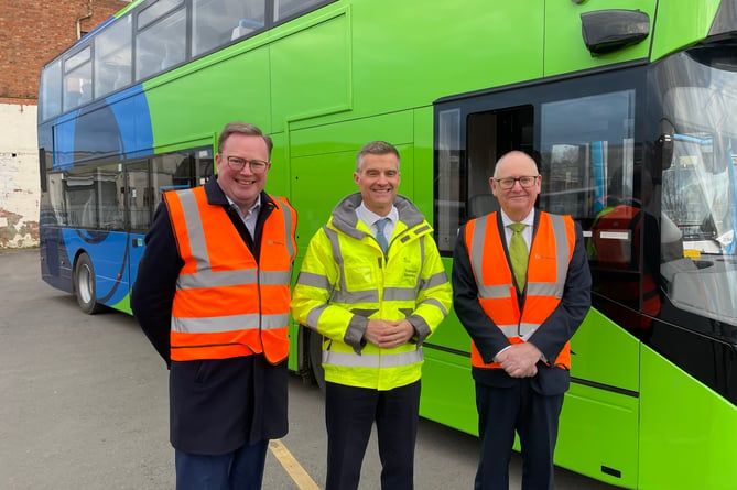 Mark Harper with Gloucestershire County Council leader Mark Hawthorne (left) and Cllr Philip Robinson with an electric bus. Picture: Gloucestershire County Council