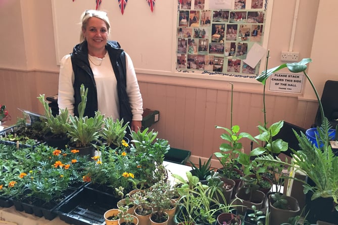 Melanie Moore with donated plants on the Dig for Victory stall.