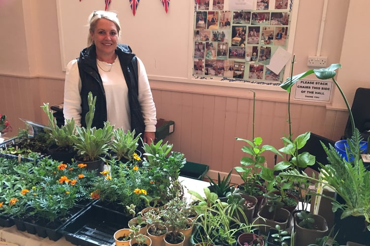 Melanie Moore with donated plants on the Dig for Victory stall.