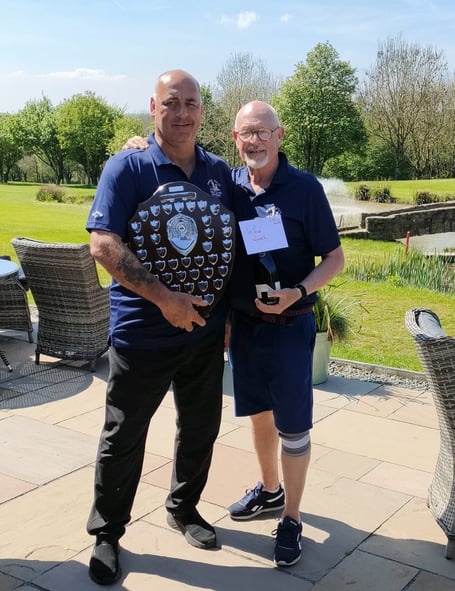 Pat Simcoe receiving the Captain's Shield from Seniors' Captain Alan "Severn" Bridges.