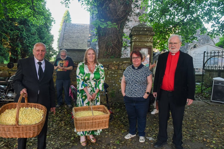 Rev Sonya Newton and Rev David Rees bless the bread and cheese for Gerald Creswick and Margaret Saunders.