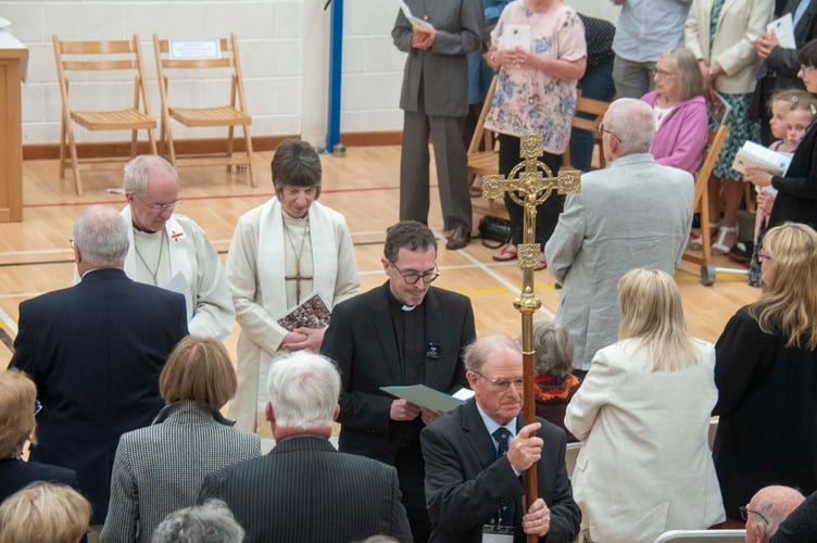 Brian Duerden leads Rev David Treharne, Archbishop Rachel Treweek and Archbishop of Canterbury Justin Welby at the end of the service.