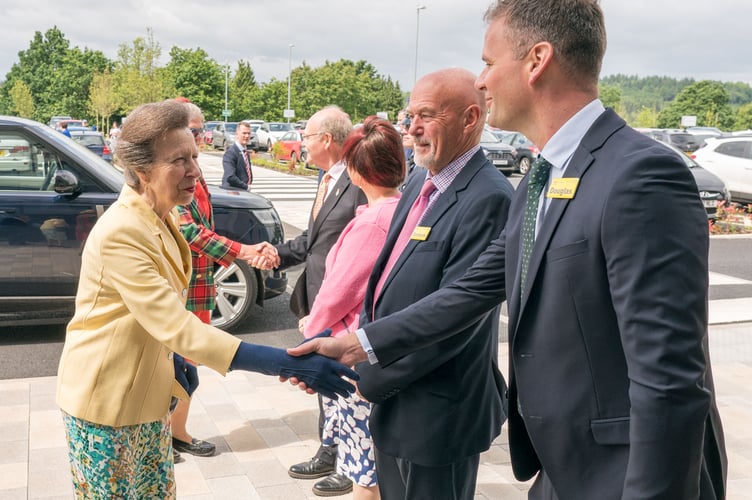 Princess Anne is welcomed to the hospital by Gloucestershire Health and Care Trust chief executive Douglas Blair.