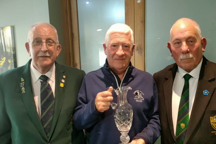 Roger Hall (centre) receiving the Dean Hills Trophy, from Geoff Norris and Dave Donoghue.