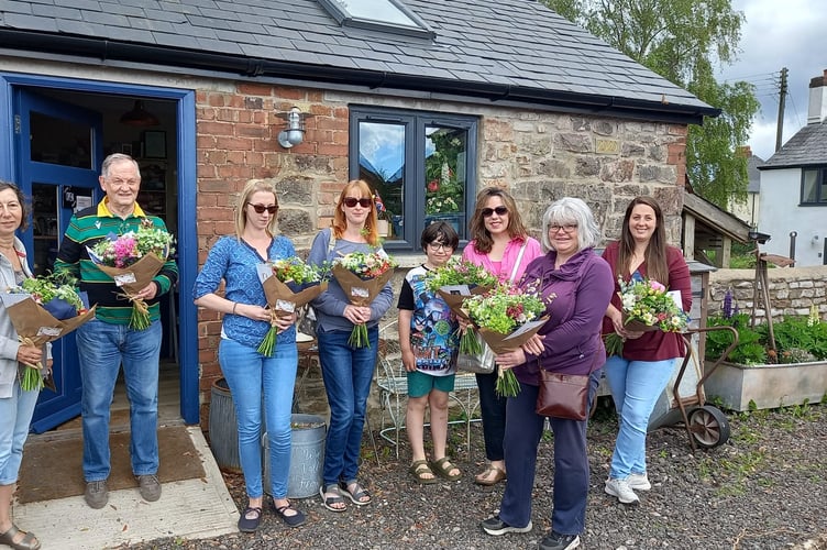 Some of the local flower lovers who picked up a bargain.