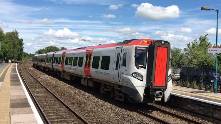 A Transport for Wales Class 197 train arrives at Lydney with a service for Maesteg.
