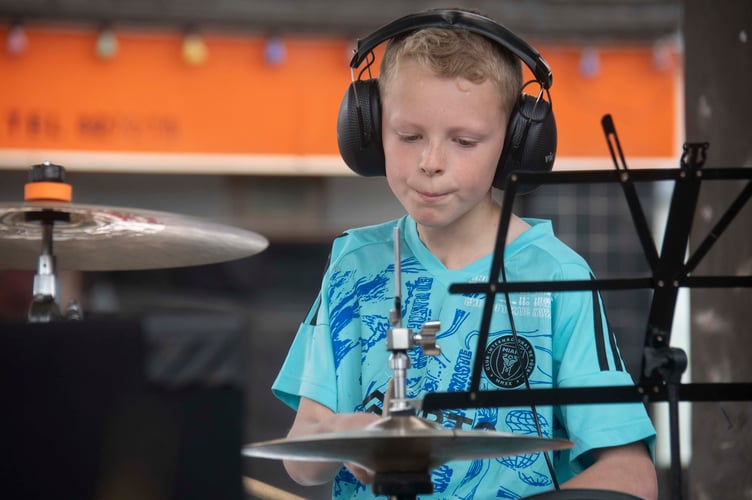 Isaac Watkins perforning Green Day's Holiday.