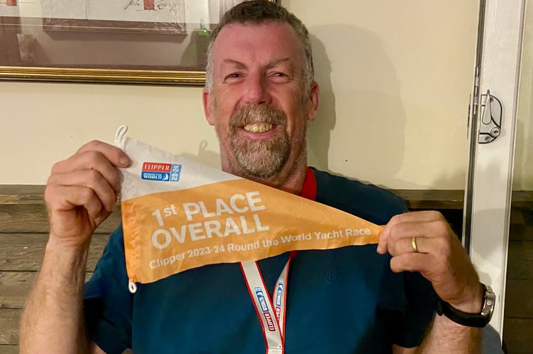 Eric Froggatt with his Clipper Round the World winner's pennant and circumnavigation medal