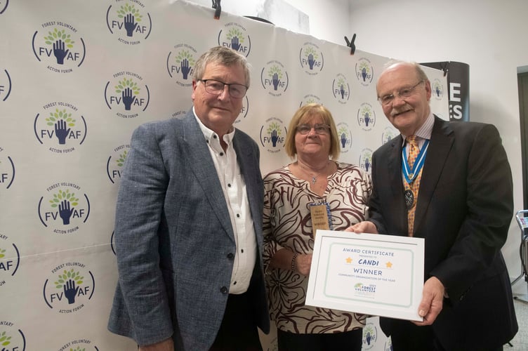 Graham Spearman (left) and Julie Abrahams received the community organisation award on behalf of CANDI from High Sheriff of Gloucestershire Mark Hurrell.