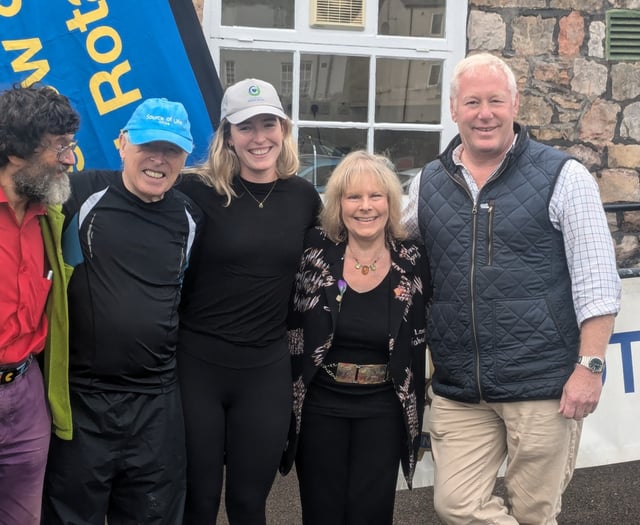 Rotarian charity walk cash to be handed over