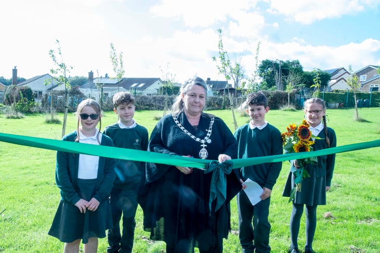 Mayor of Lydney Cllr Natasha Saunders and members of the Primrose Hill eco council officially open the new orchard.