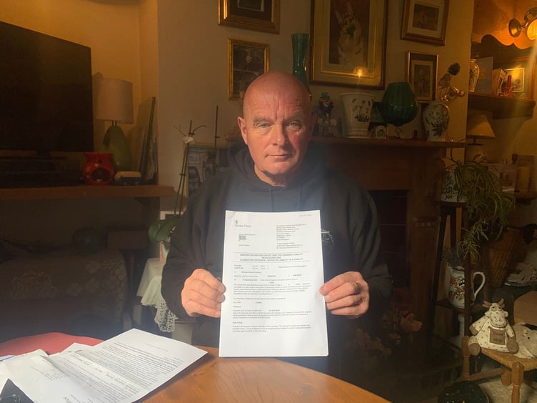 Fletcher with the fine he received in the post