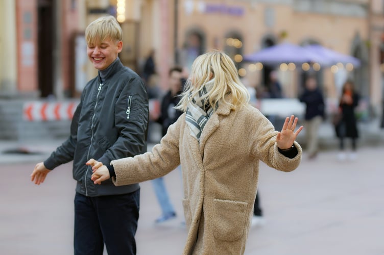 Couple dancing in the street