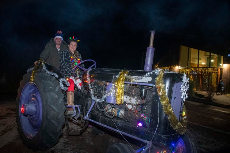 Jessica Shackell and Paul Morgan on a Nuffield 4 tractor.