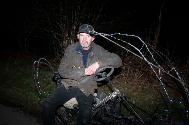 Gareth Maxfield with his moped and stump grinder combination