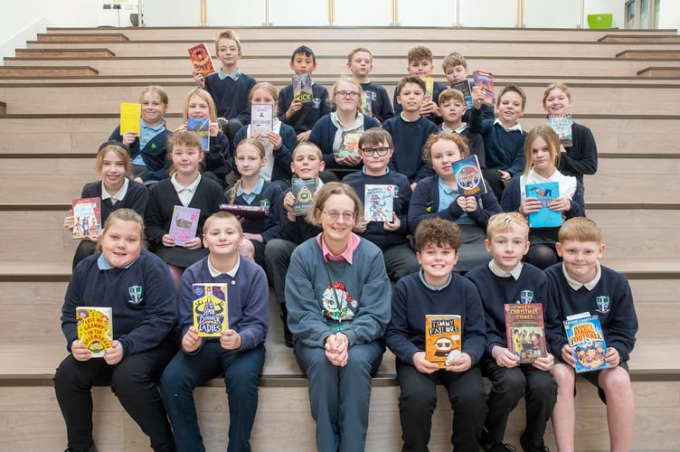 Year Six pupils with reading volunteer Deborah Talbott