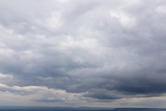 Partly cloudy today continuing tomorrow with a slight chance of rain