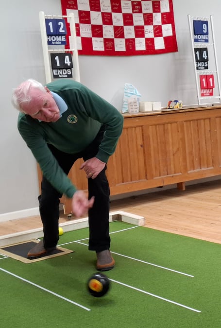 Jerry Haslett (skip) delivers the last bowl of the match against Dingestow
