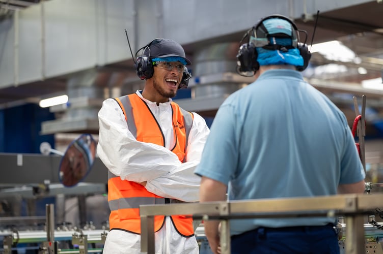 Jude Bellingham with one of the workers at the factory 