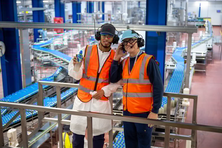 Jude Bellingham with one of the workers at the factory 