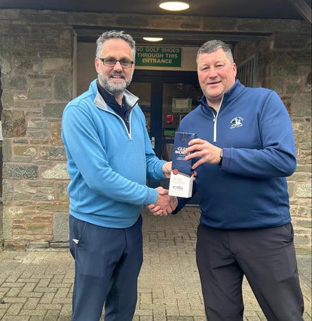 Gary Davies (left) receiving his prize from Men's Captain, Mark Graham for guessing the length of the drive-in.