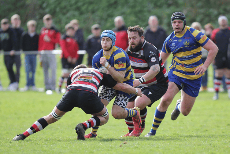 Ollie Parks powers into a tackle