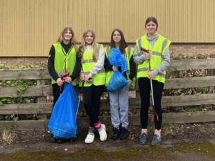 Rugby girls' fundraising boosted by litter pick