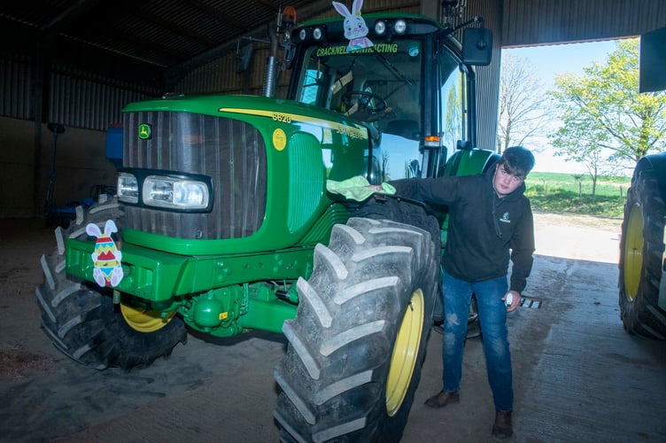 Bryce Mather gives his vehicle a polish before the start of the run.