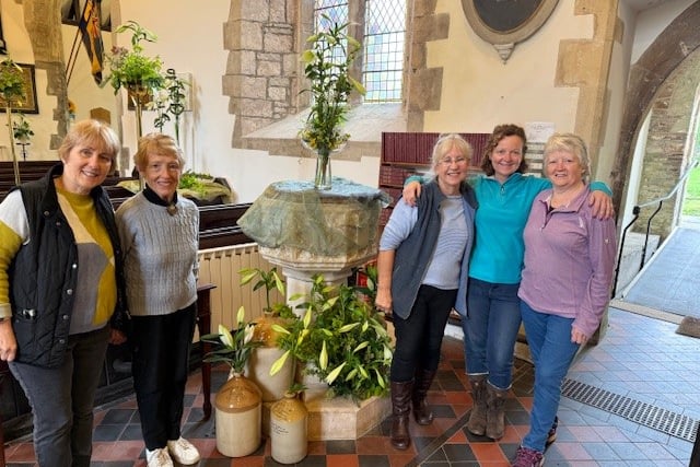 Vanessa Martin, Beryl Griffiths, Meryl Williams, Eleanor Cook and Margaret Willis with a display of lilies.