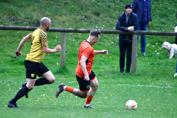 Catch me if you can. A Monmouth player launches at attack