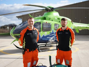 MP walks on fire for air ambulance